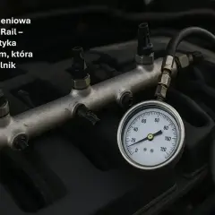 Listwa Common Rail z podłączonym manometrem do diagnostyki, kluczowa dla zdrowia silnika.