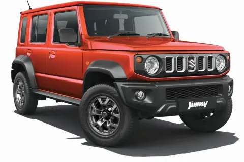 Pomarańczowy Suzuki Jimny 5-drzwiowy, gotowy na przygody. Sprawdź jego cenę i możliwości terenowe!