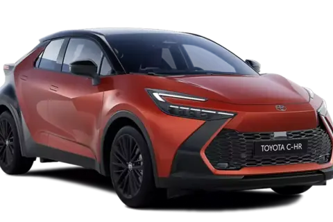 Pomarańczowy Toyota C-HR 2025 z czarnym dachem i felgami, prezentujący futurystyczny design z ostrymi liniami i agresywnym przodem.